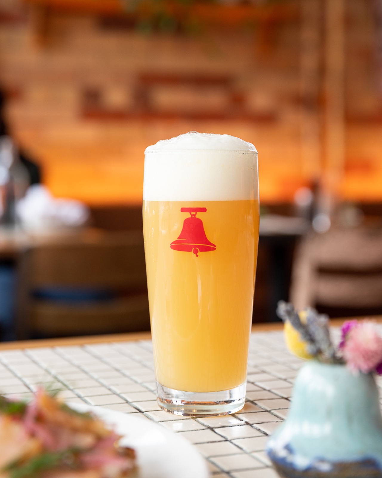 A pint of Bellwoods beer on the brewpub bar